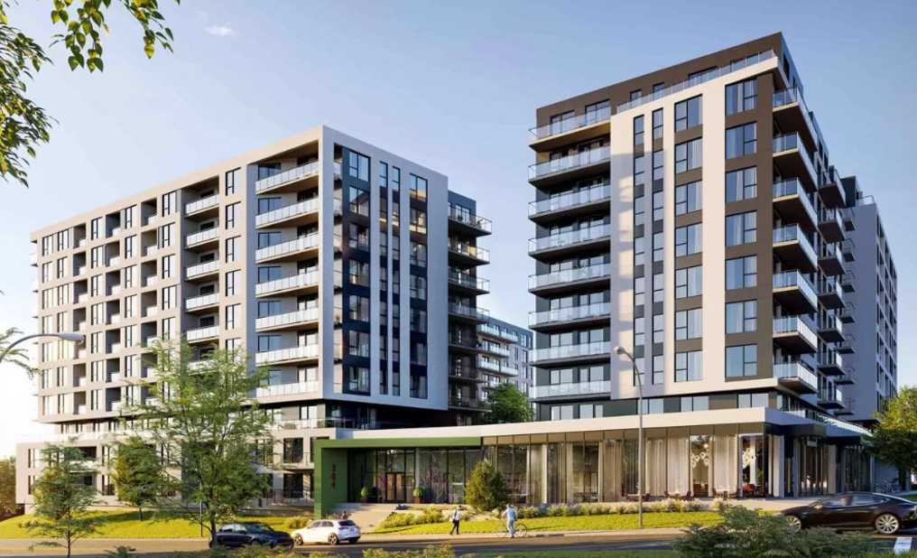 Immeubles d'appartements modernes avec balcons par une journée ensoleillée.