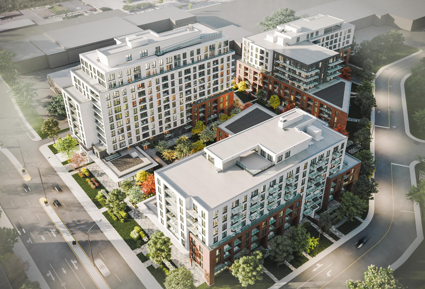 Vue aérienne d'un complexe d'appartements moderne avec plusieurs bâtiments, cours et rues environnantes.