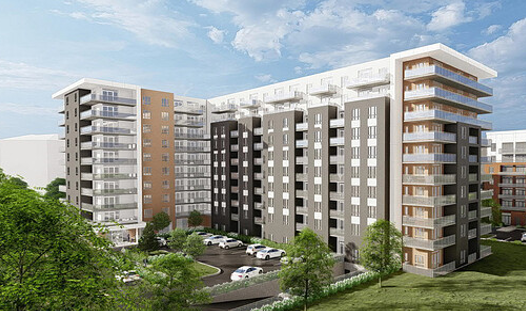 Extérieur d'un immeuble d'appartements avec balcons, stationnement, arbres et ciel nuageux.
