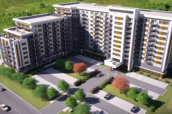 Complexe d'appartements moderne avec balcons, terrain paysager et parking.