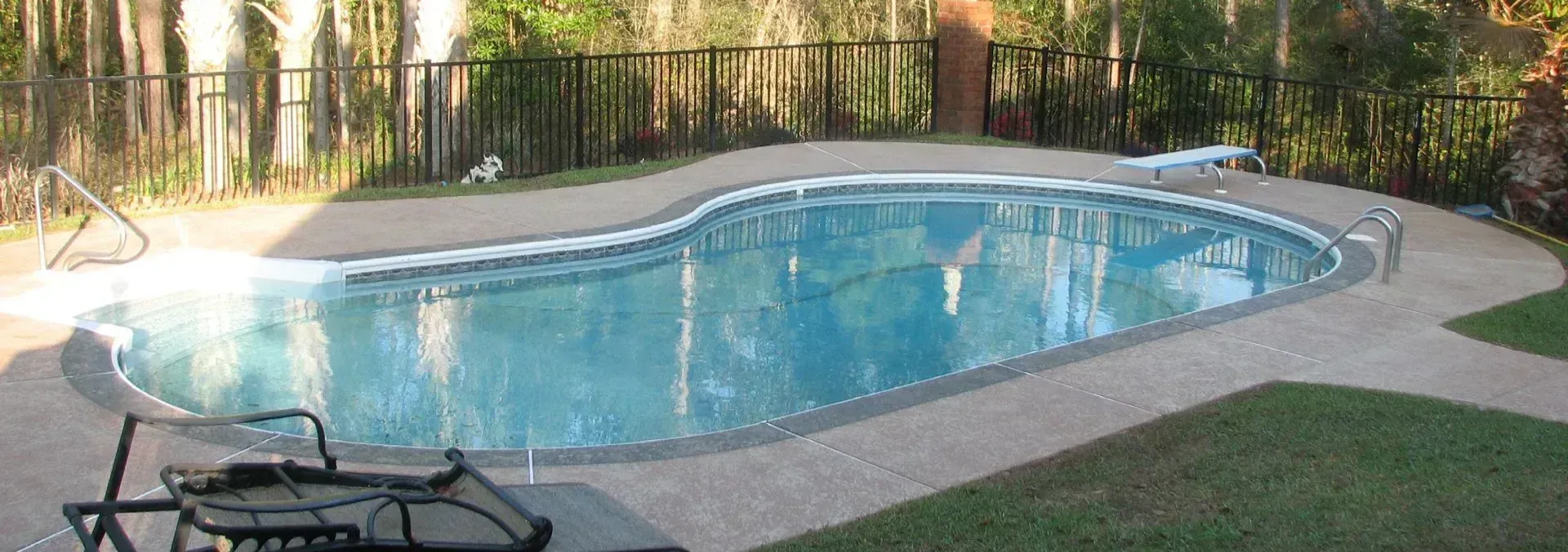 A kidney-shaped swimming pool.