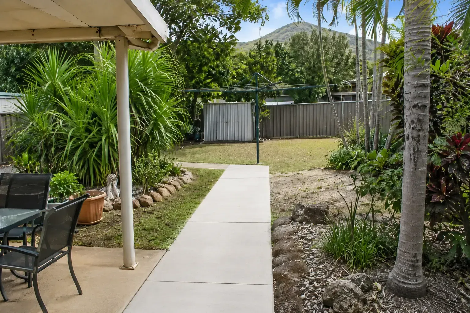 Plain concrete pathway providing great access to a backyard clothesline in Townsville