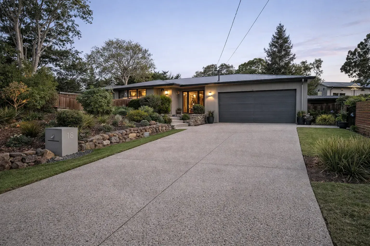 New concrete driveway leading to a brick house in Hyde Park, Townsville