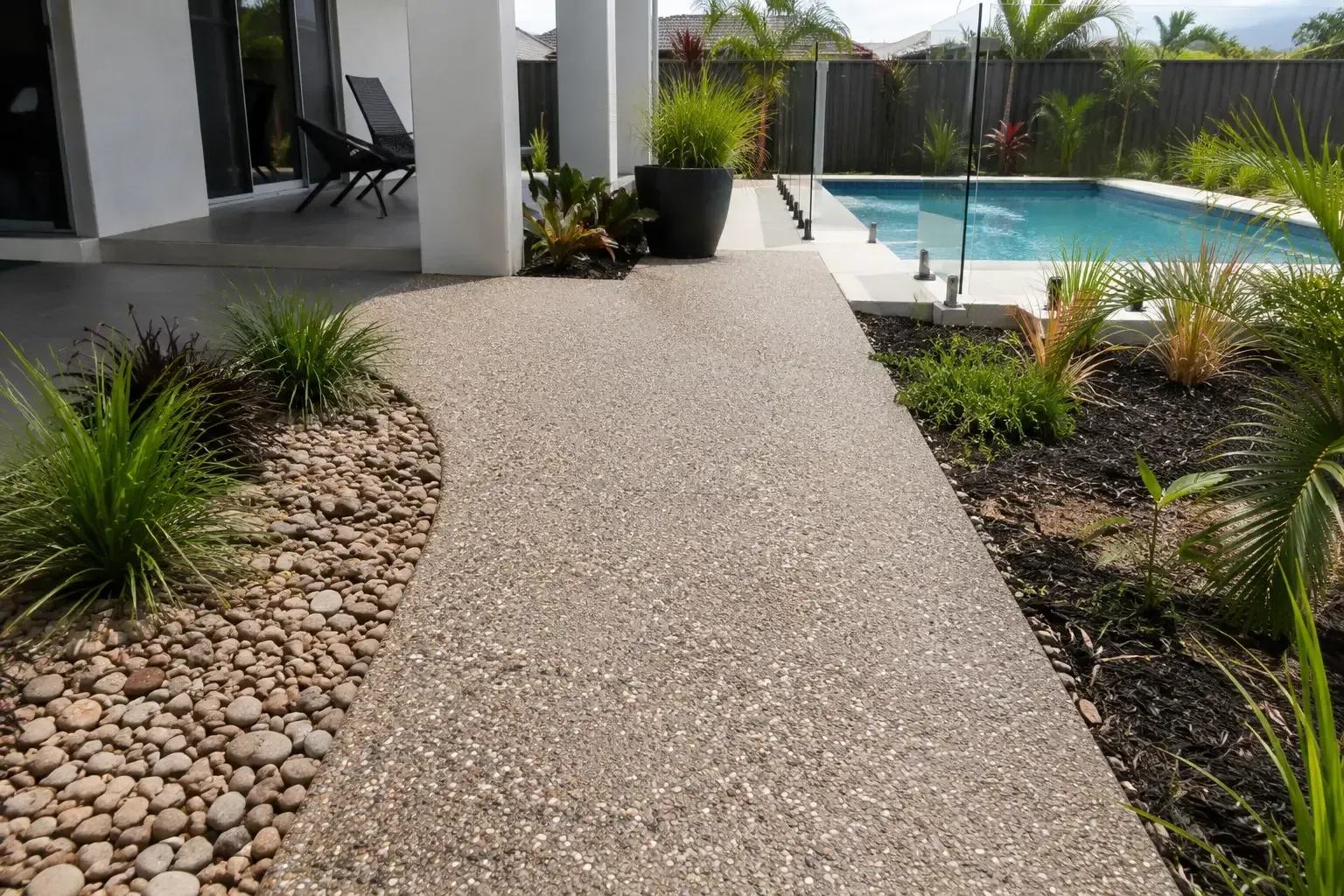 Exposed Aggregate pathway leading to a pool areas in Townsville.