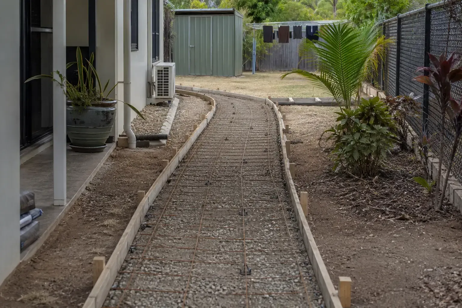 Backyard path in progress. Boxed up and reinforcements down. Awaiting concrete pour.