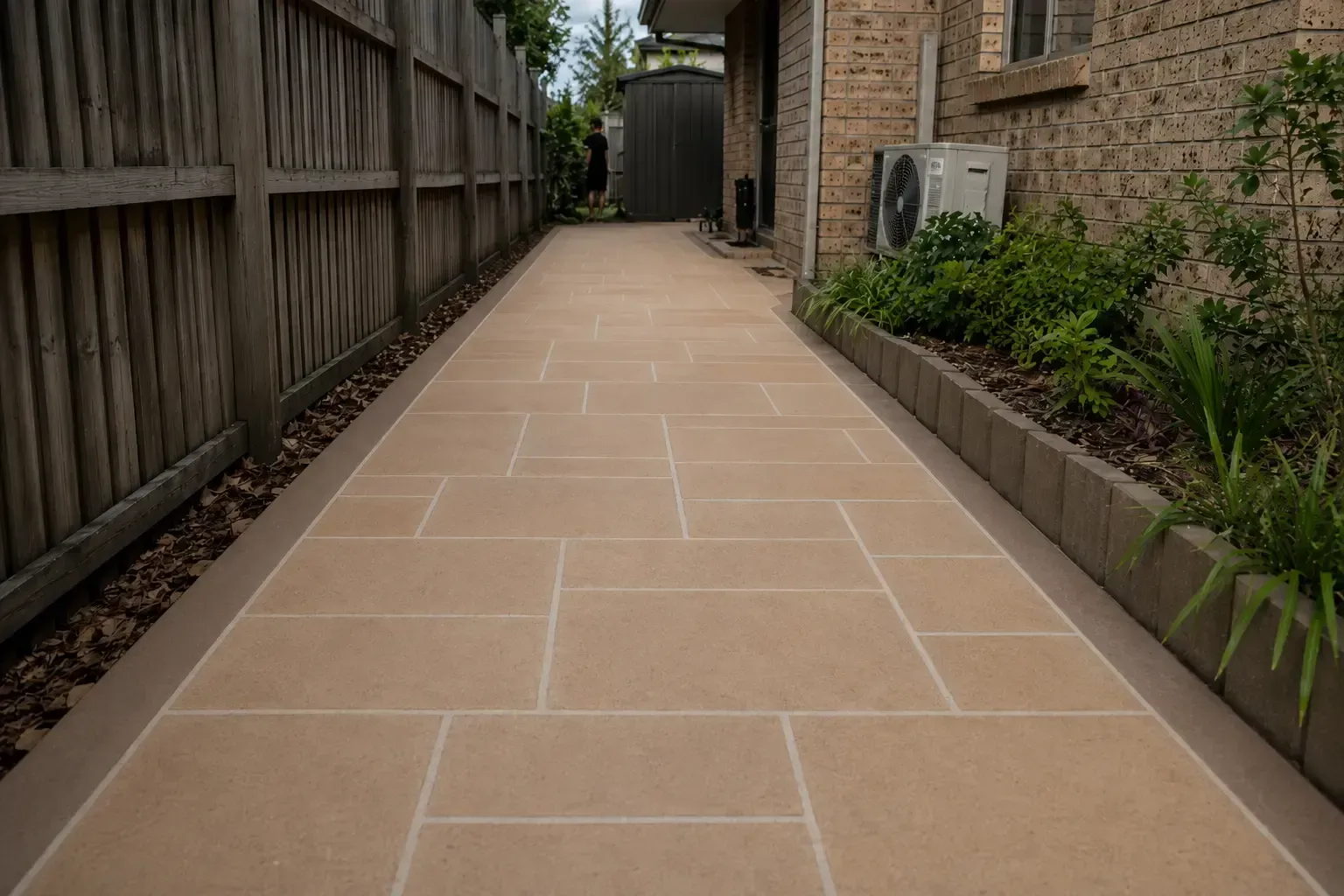 Stencilled concrete pathway along the side of a house in Townsville.