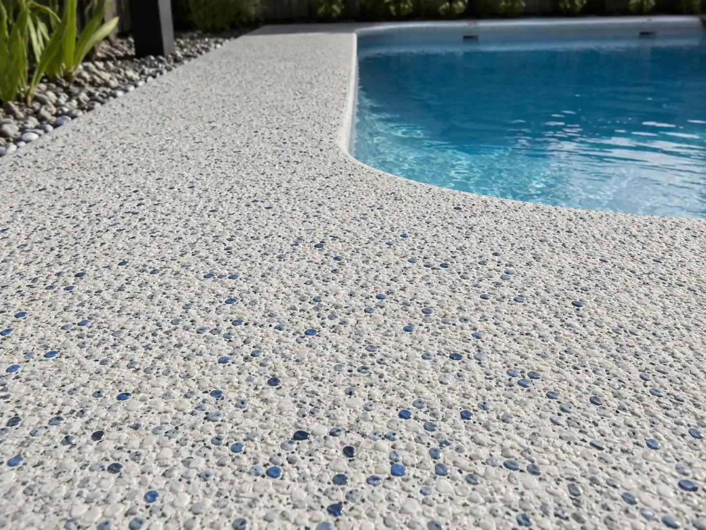 Textured exposed aggregate pool surround in Aitkenvale, Townsville.