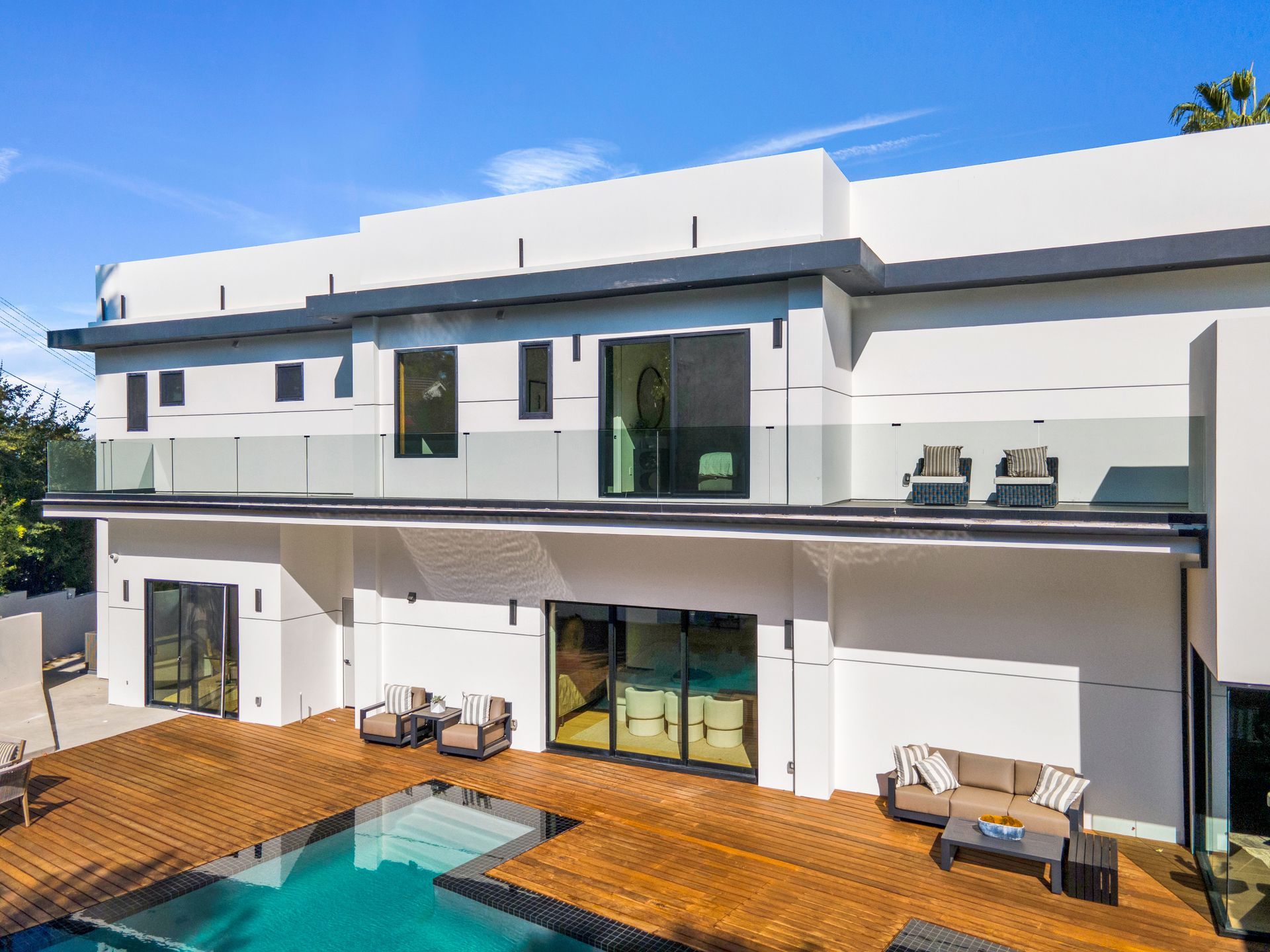 Frameless glass pool railing and deck at a modern Los Angeles home, installed by Glass Kings.