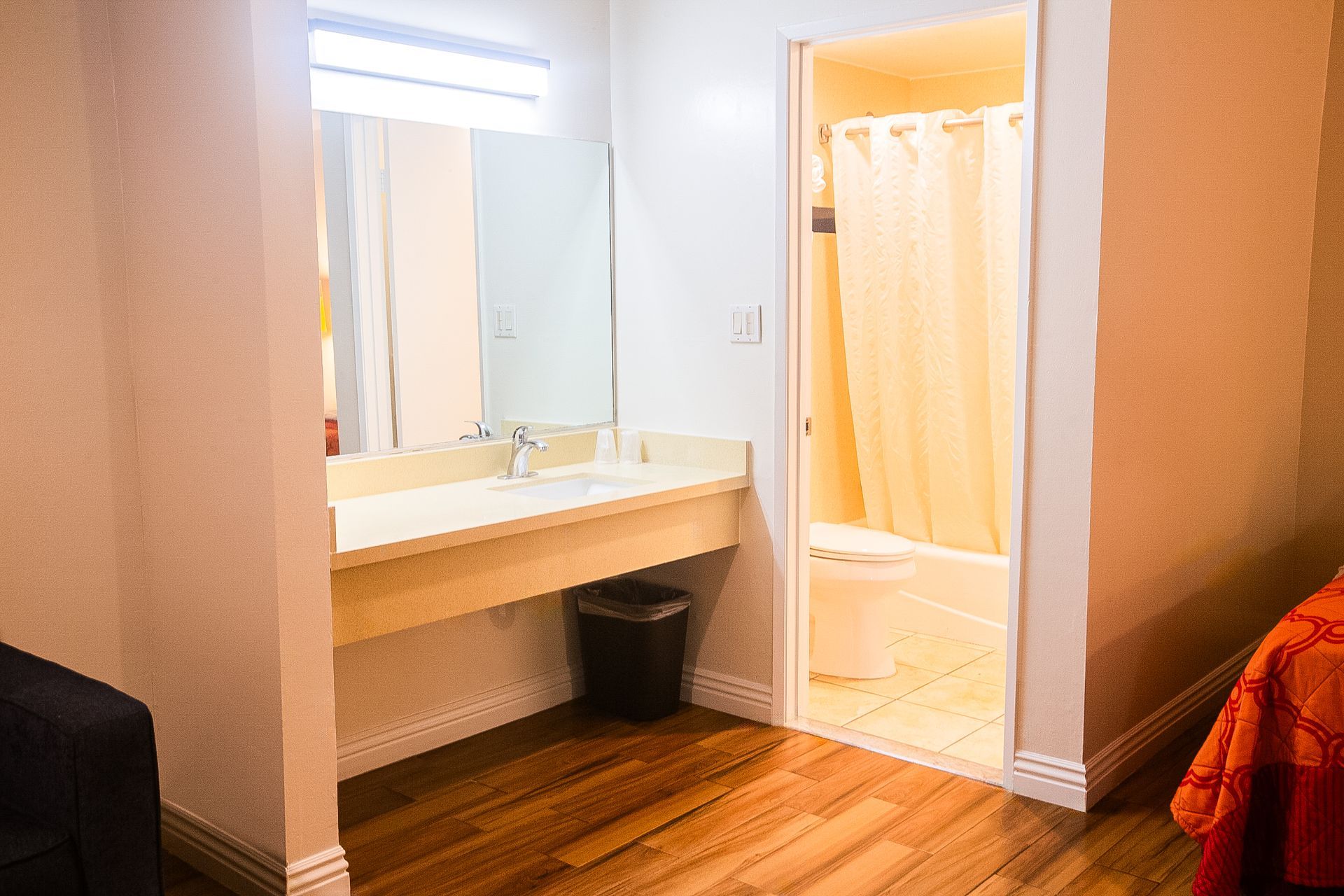 Bathroom and vanity area with a doorway to the toilet and shower.