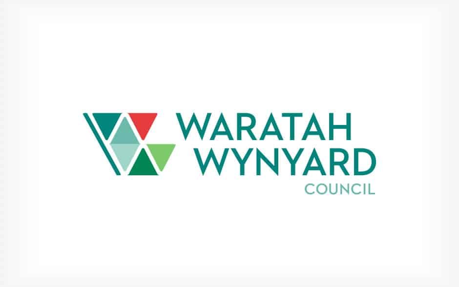 The logo for the waratah wynyard council is green and red.