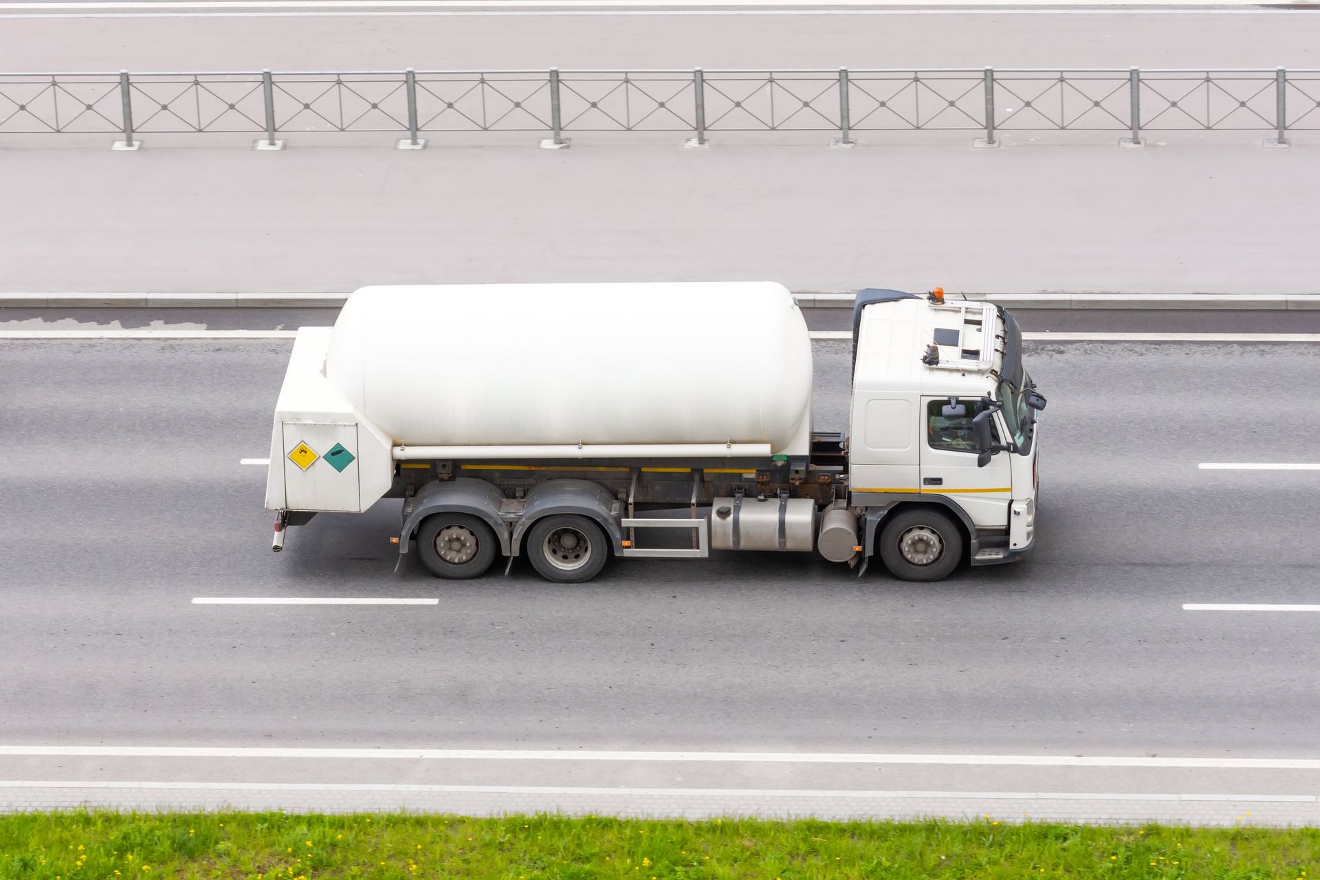 Propane gas transport truck representing safe propane tank delivery services for commercial supply.