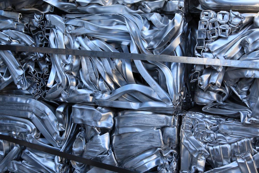 A Pile of Scrap Metal Is Stacked on Top of Each Other — H & H Metal Recycling In Landsborough, QLD