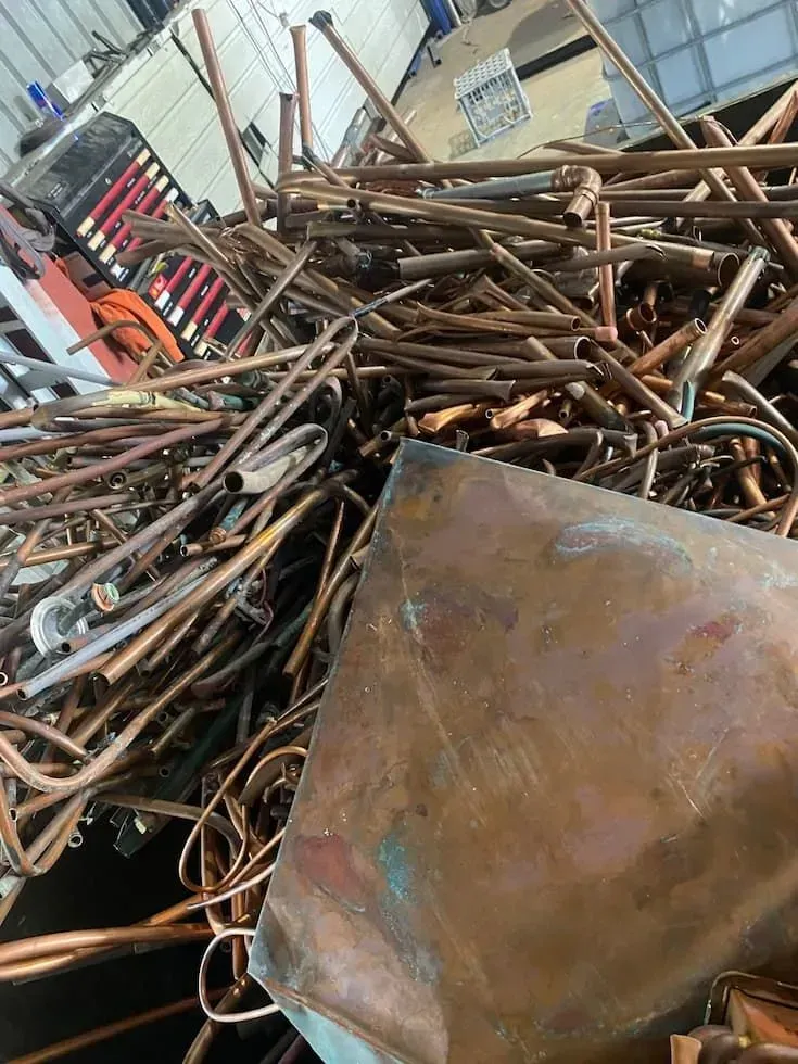 A Pile of Copper Pipes and Sheet