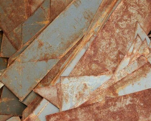 A Pile of Rusty Metal Pieces Stacked on Top of Each Other — H & H Metal Recycling In Cooroy, QLD