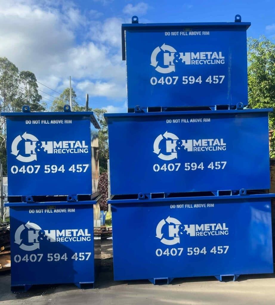 Blue Metal Recycling Bins Stacked, Labeled With