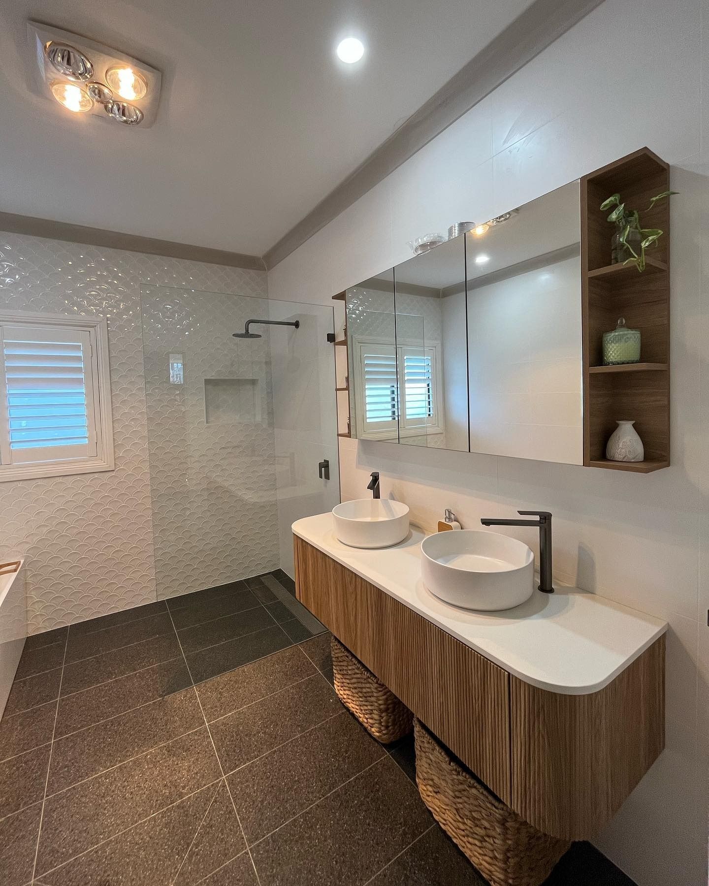 Modern Bathroom With Wood Vanity, Two Vessel Sinks, Large Mirror, and Tiled Shower — Cobra Plumbing & Bathrooms in Kiama, NSW