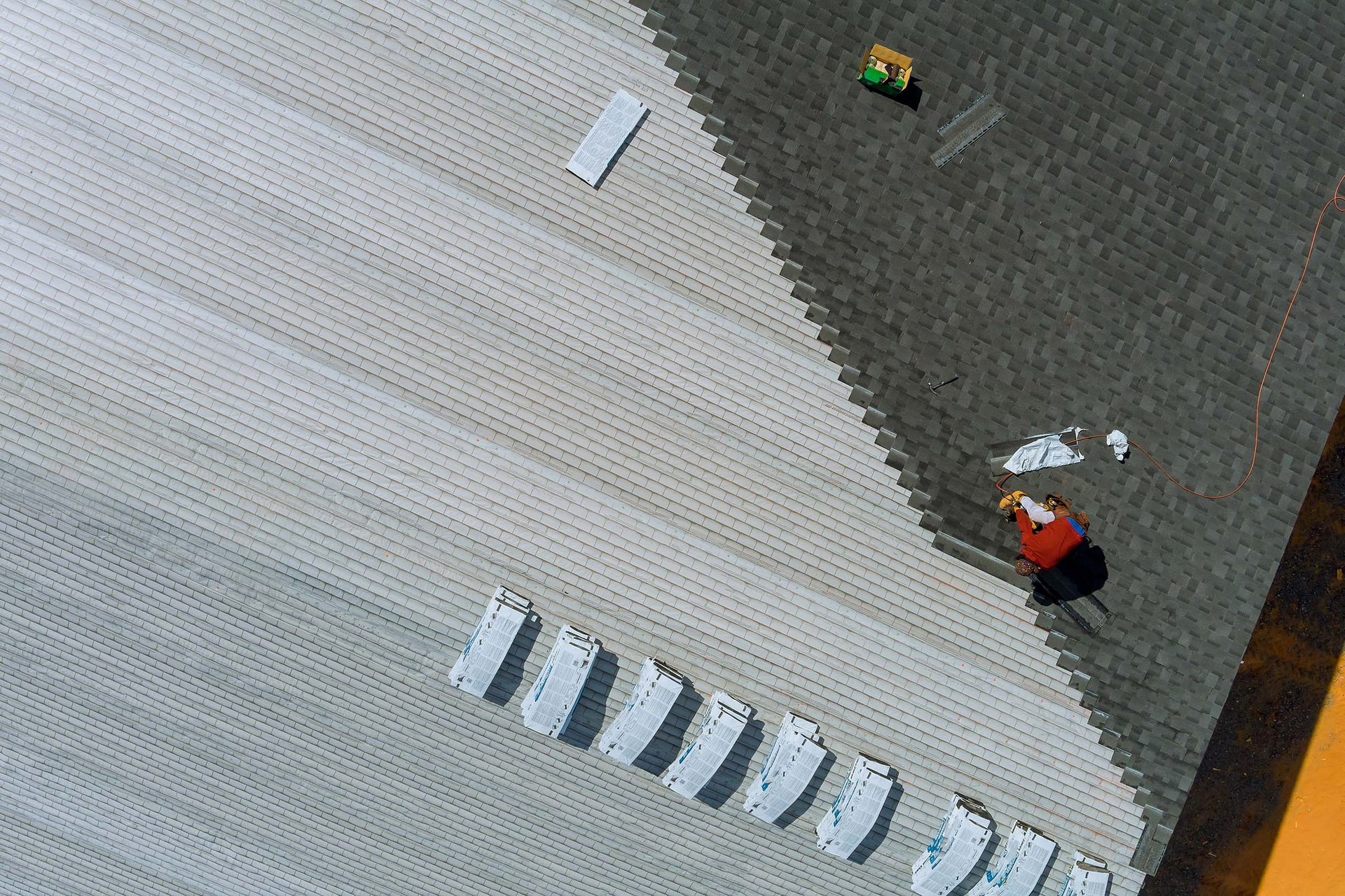 An aerial view of a group of people standing on a sidewalk.