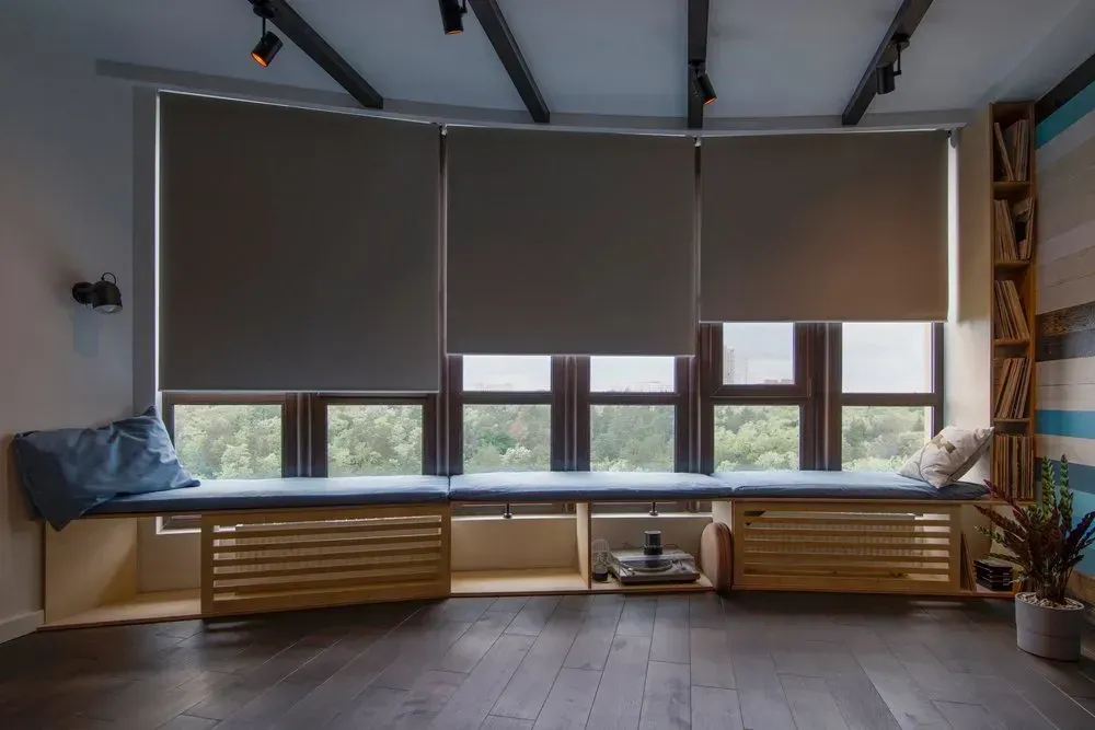 A Living Room With A Window Seat And A Bookshelf — Coastal Blind Installations In Agnes Waters, QLD