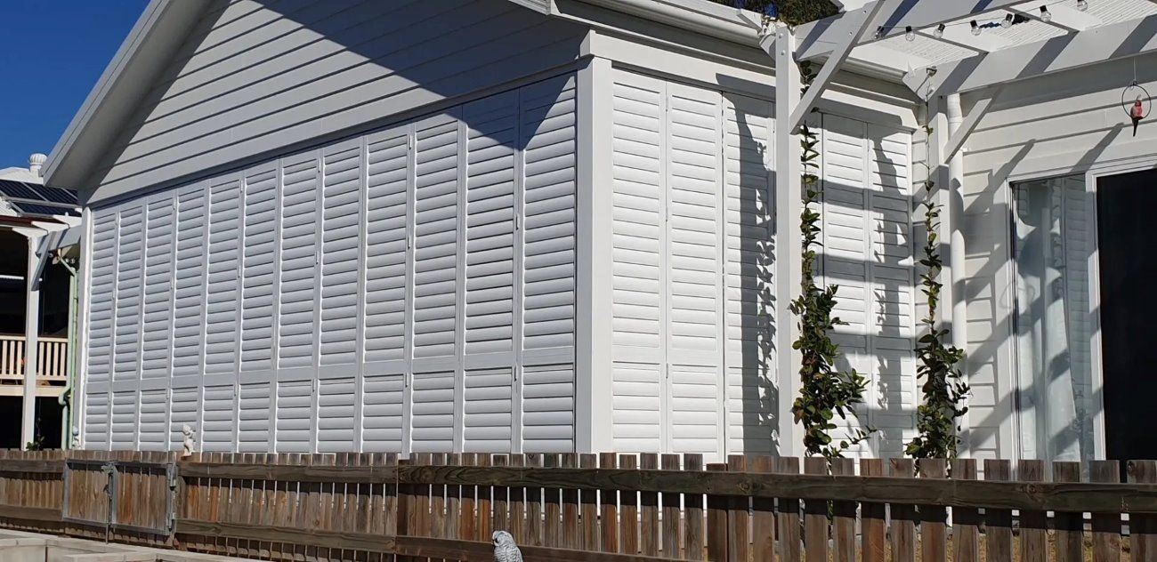 White Shutters With Plants — Shutters in Bundaberg, QLD