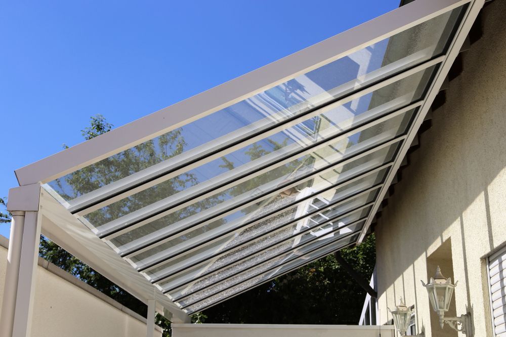 A House With A White Awning On The Front Porch — Coastal Blind Installations In Kensington, QLD