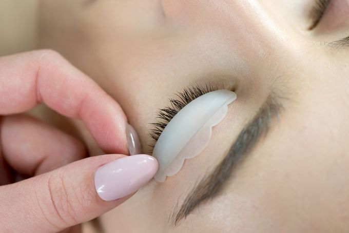A Woman Is Getting Her Eyelashes Done At A Beauty Salon — Doubleview Health & Beauty In Elanora, QLD