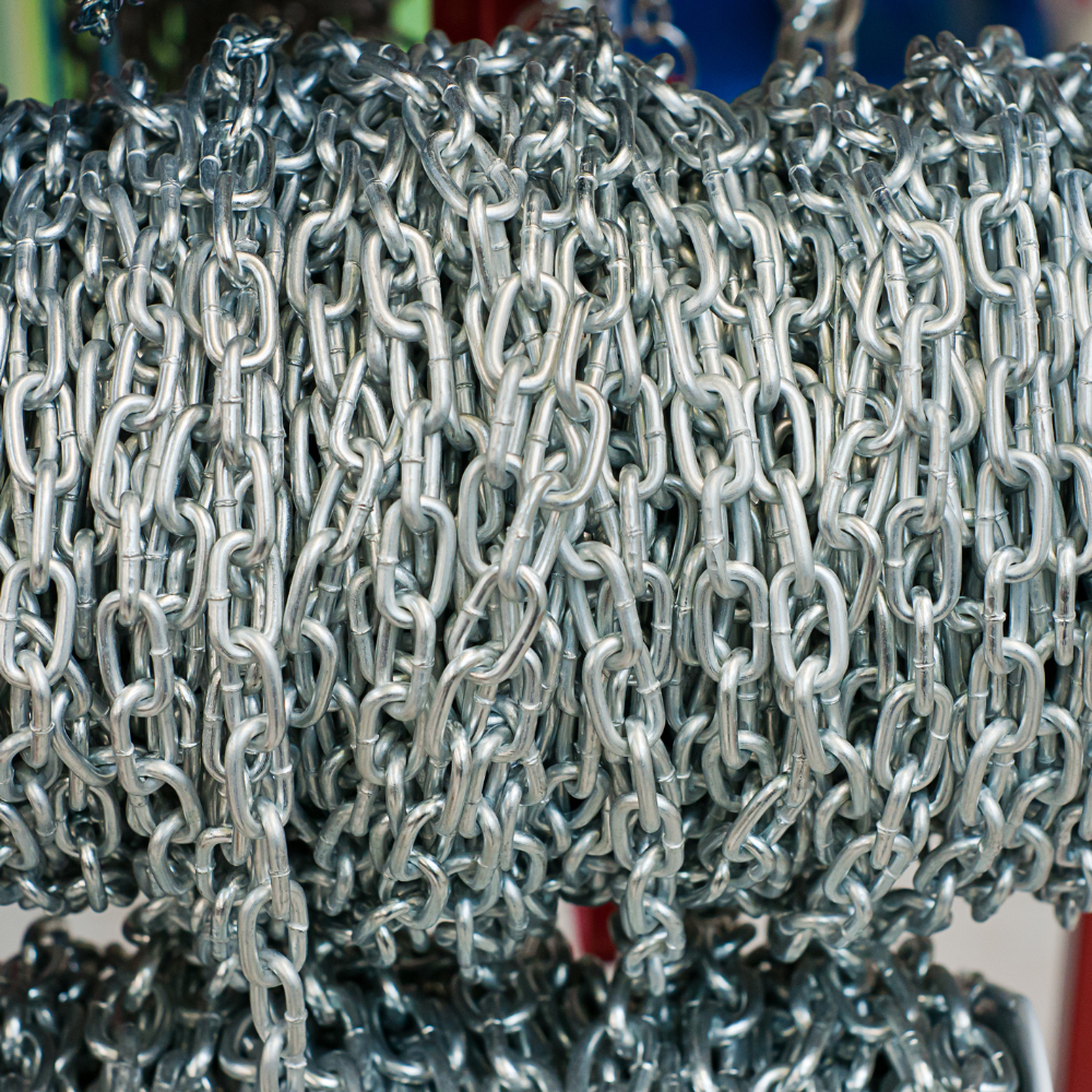 Close-up of a coiled silver chain with interlocking metal links
