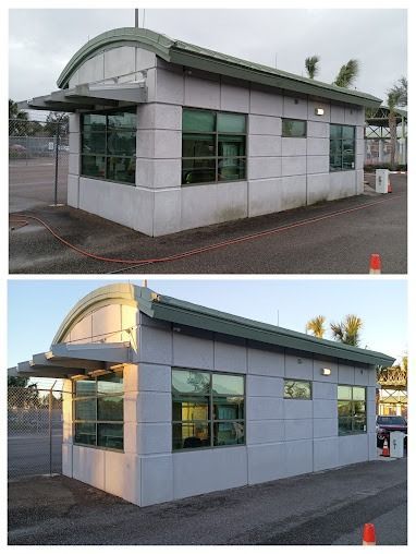 Small modern kiosk with gray walls, green roof, and large windows, shown in two lighting conditions.