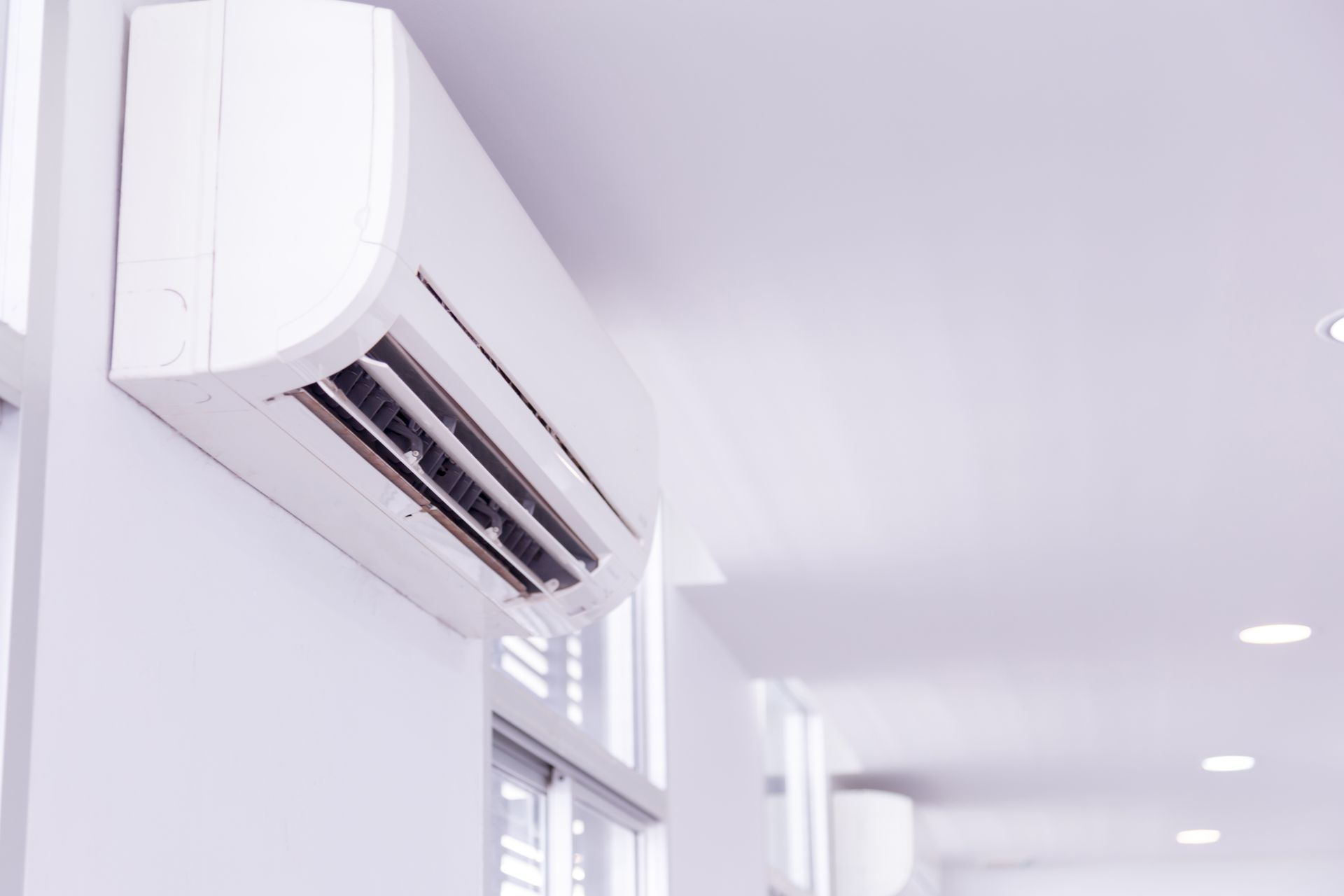 Wall-mounted air conditioner installed by local heating and cooling company for efficient cooling service

