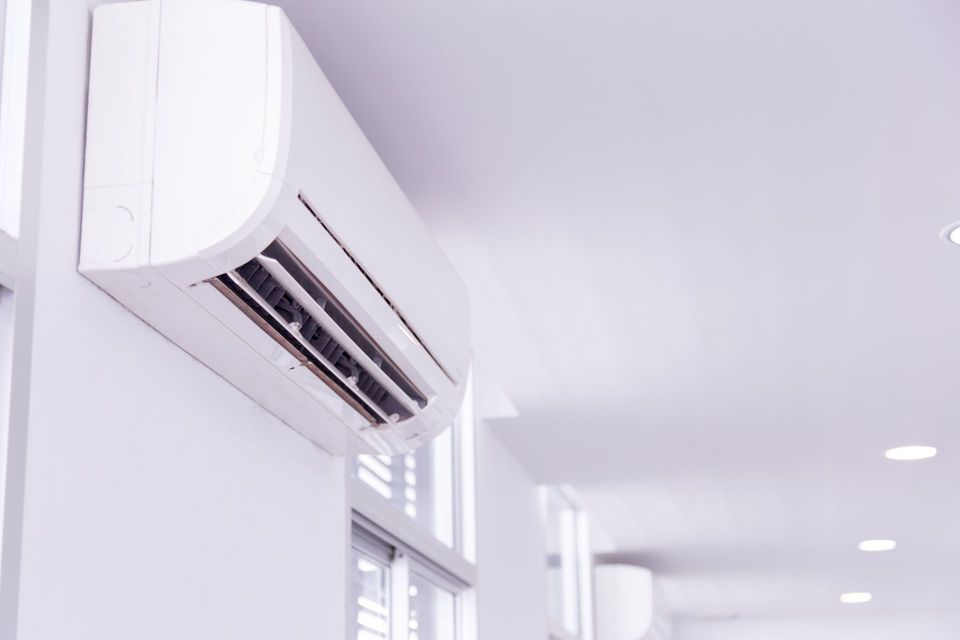 Wall-mounted air conditioner installed by local heating and cooling company for efficient cooling service