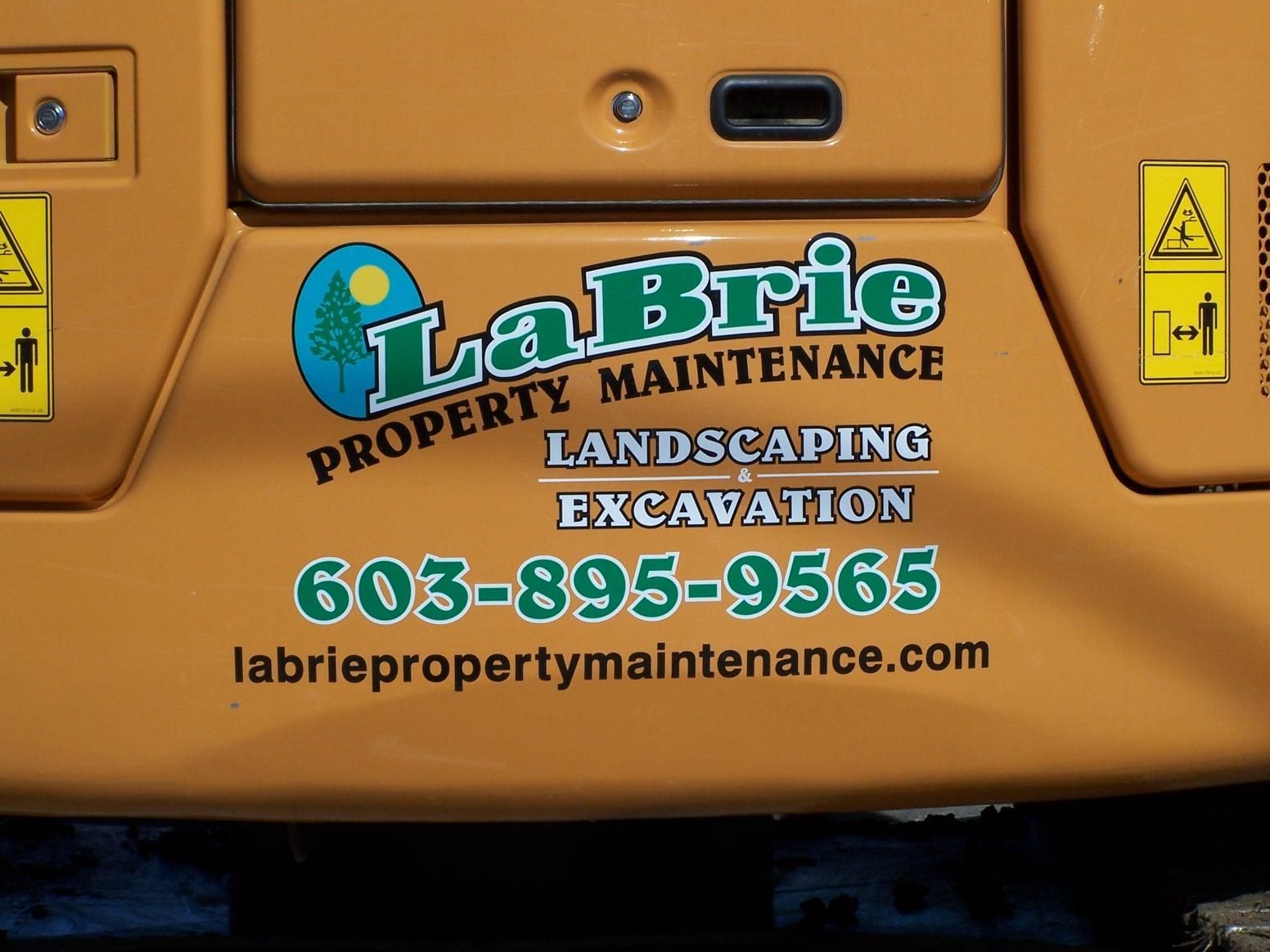 The back of a labrie property maintenance landscaping excavation vehicle