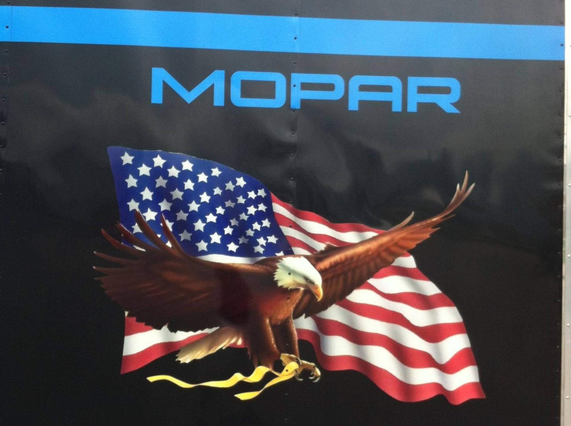 A mopar sign with an american flag and an eagle on it