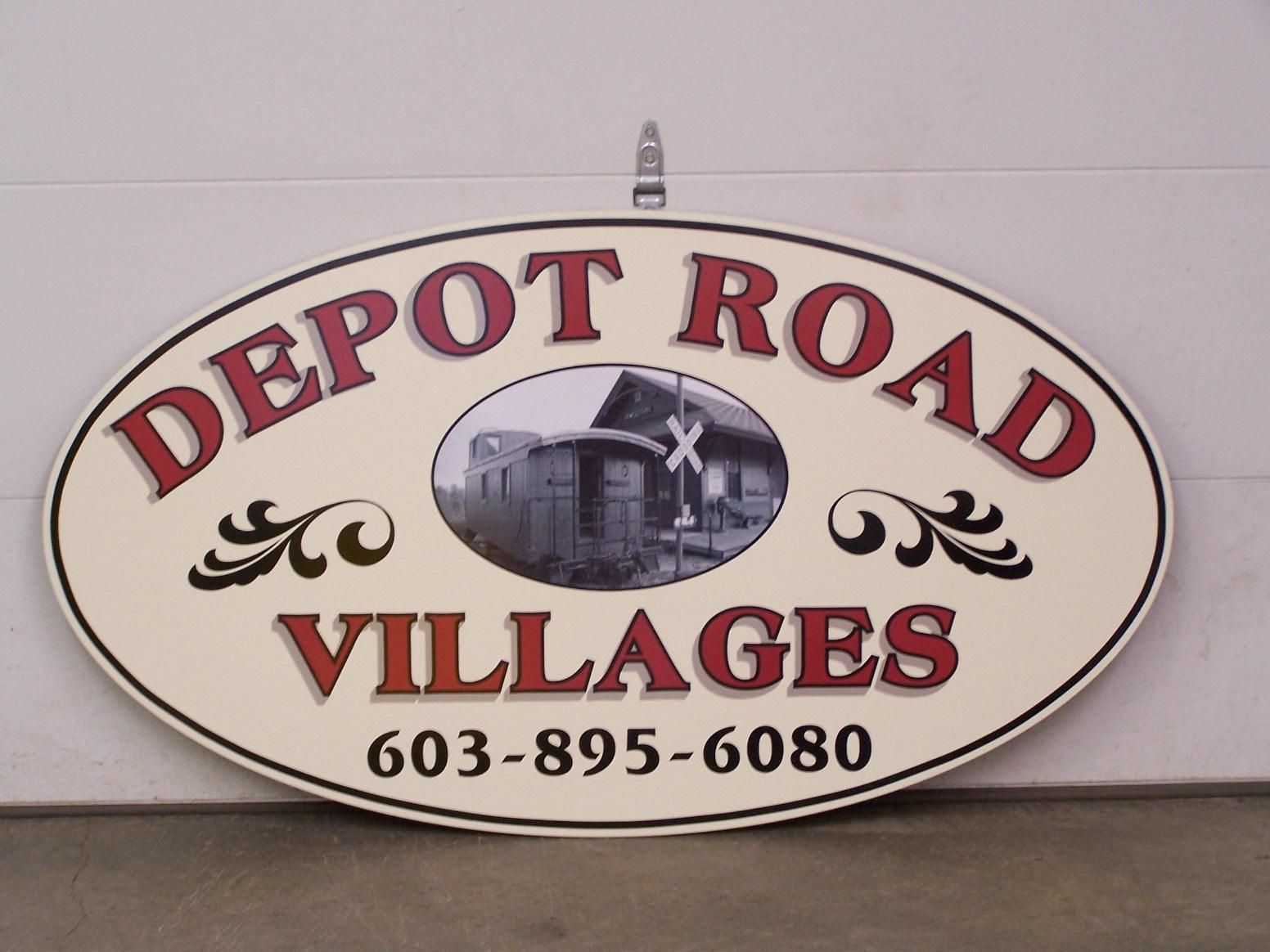 A sign that says depot road villages on it
