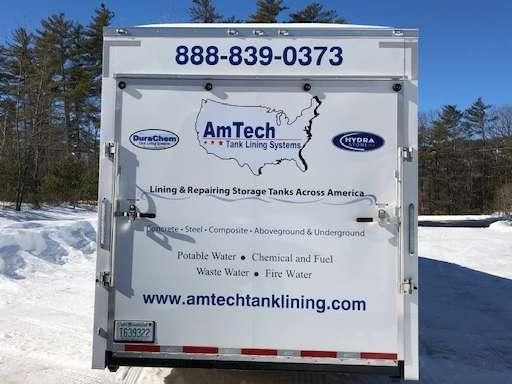 The back of a white trailer with a map of the united states on it.