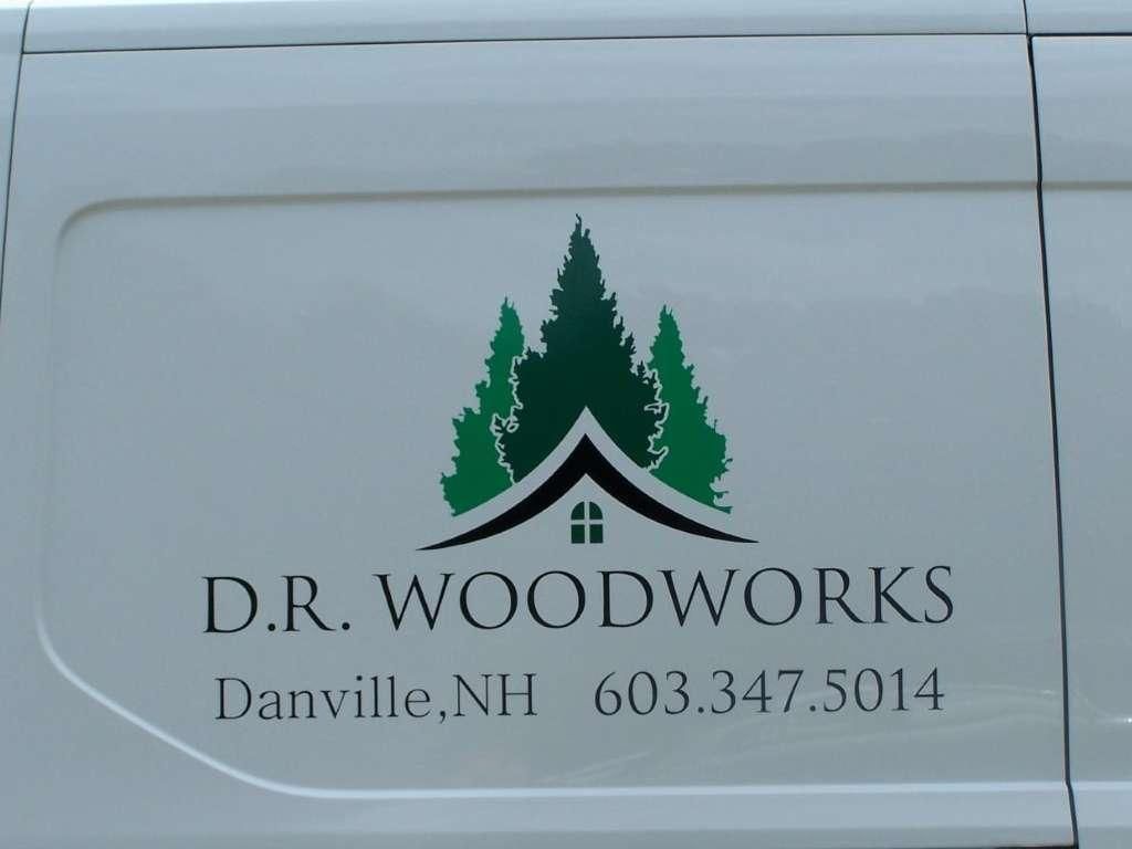 A white van with a logo for d.r. woodworks