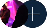 Dark silhouettes in front of pink stage lights, with a navy circle and white plus sign on the right