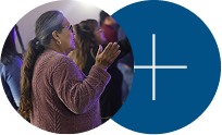 Two overlapping circles, one showing a person clapping and one blue with a white plus sign