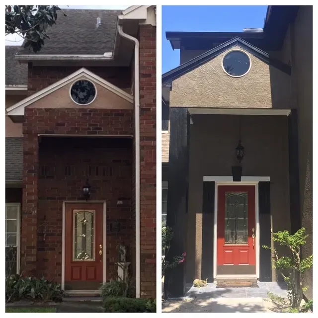 Two front-entry townhouse facades side by side, each with a red door and round window above.