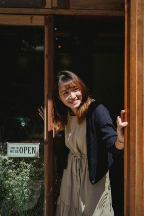 Woman smiling in doorway with