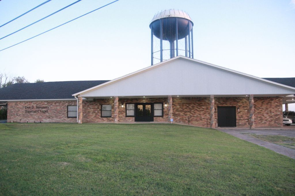 A large building with a water tower on top of it
