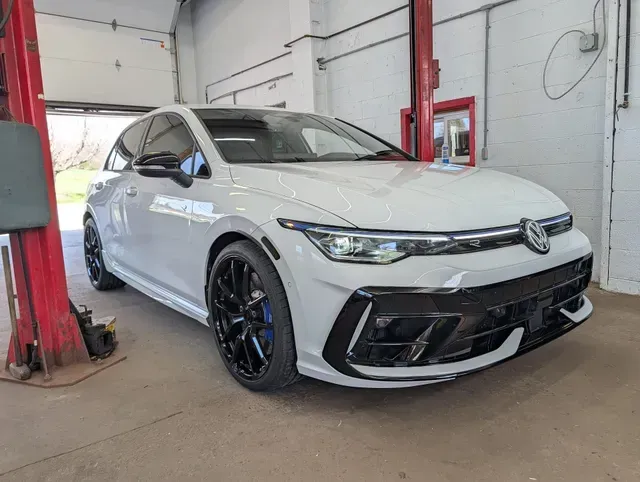 White Volkswagen In Auto Repair Bay | Treadlogic