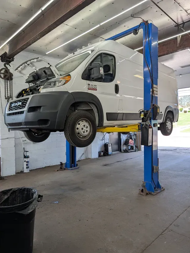 Work Van On Lift For Auto Repair | Treadlogic