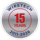 Wiretech 15th Anniversary logo. Silver badge with blue text, red circle, and numbers 15 and years. 2011-2026.