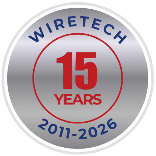 WireTech 15 Year Anniversary Badge - a silver circle with a red number 15 and the words WireTech arched across the top