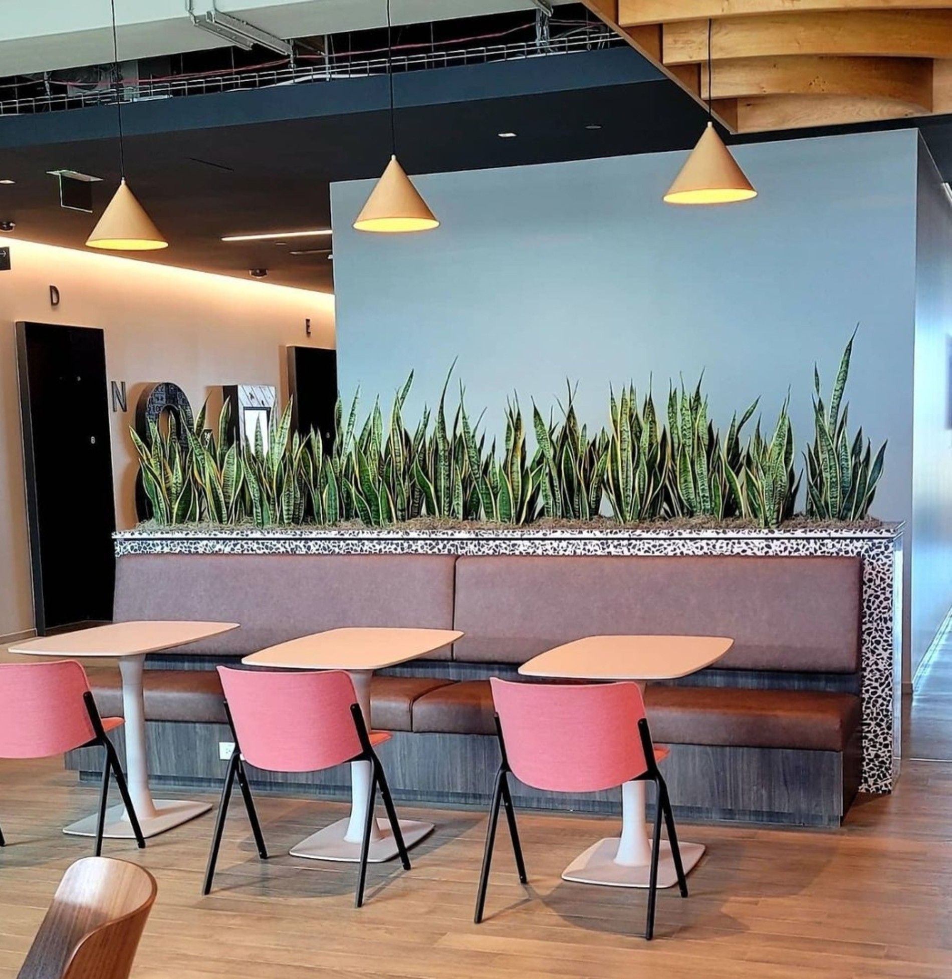 a row of tables and chairs in a restaurant