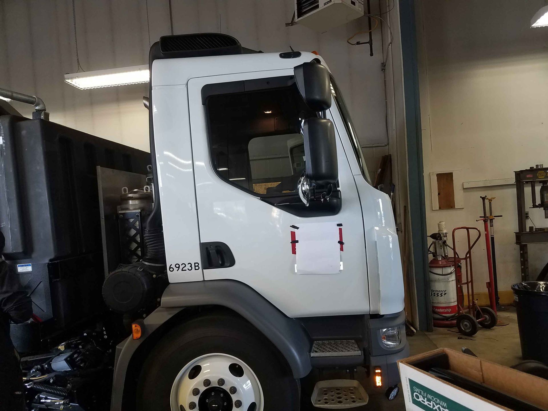 White truck cab in a garage.