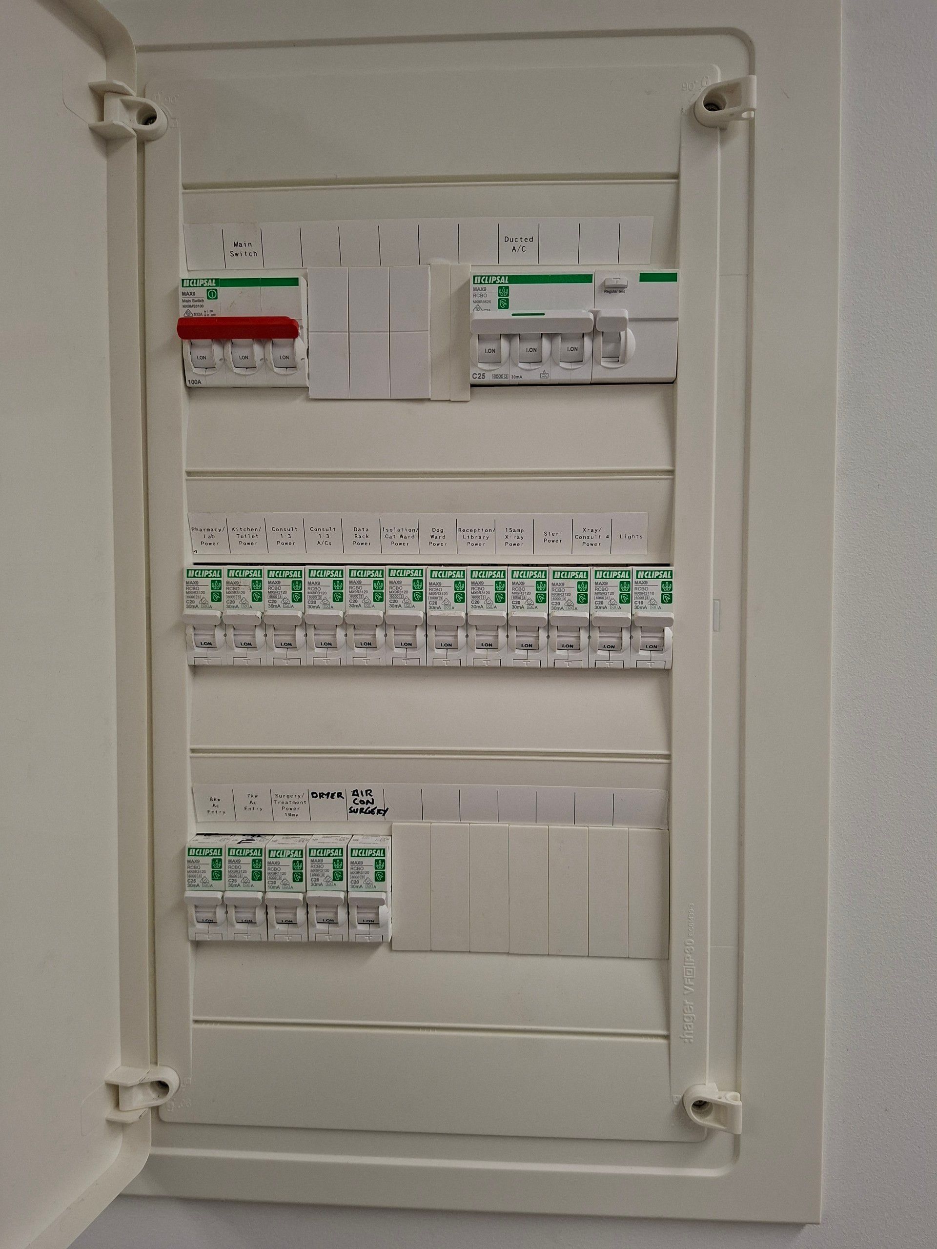 Electrical Breaker Panel With Rows of White Circuit Breakers — AC/DC Electrical, Air Conditioning & Refrigeration In Zilzie, QLD