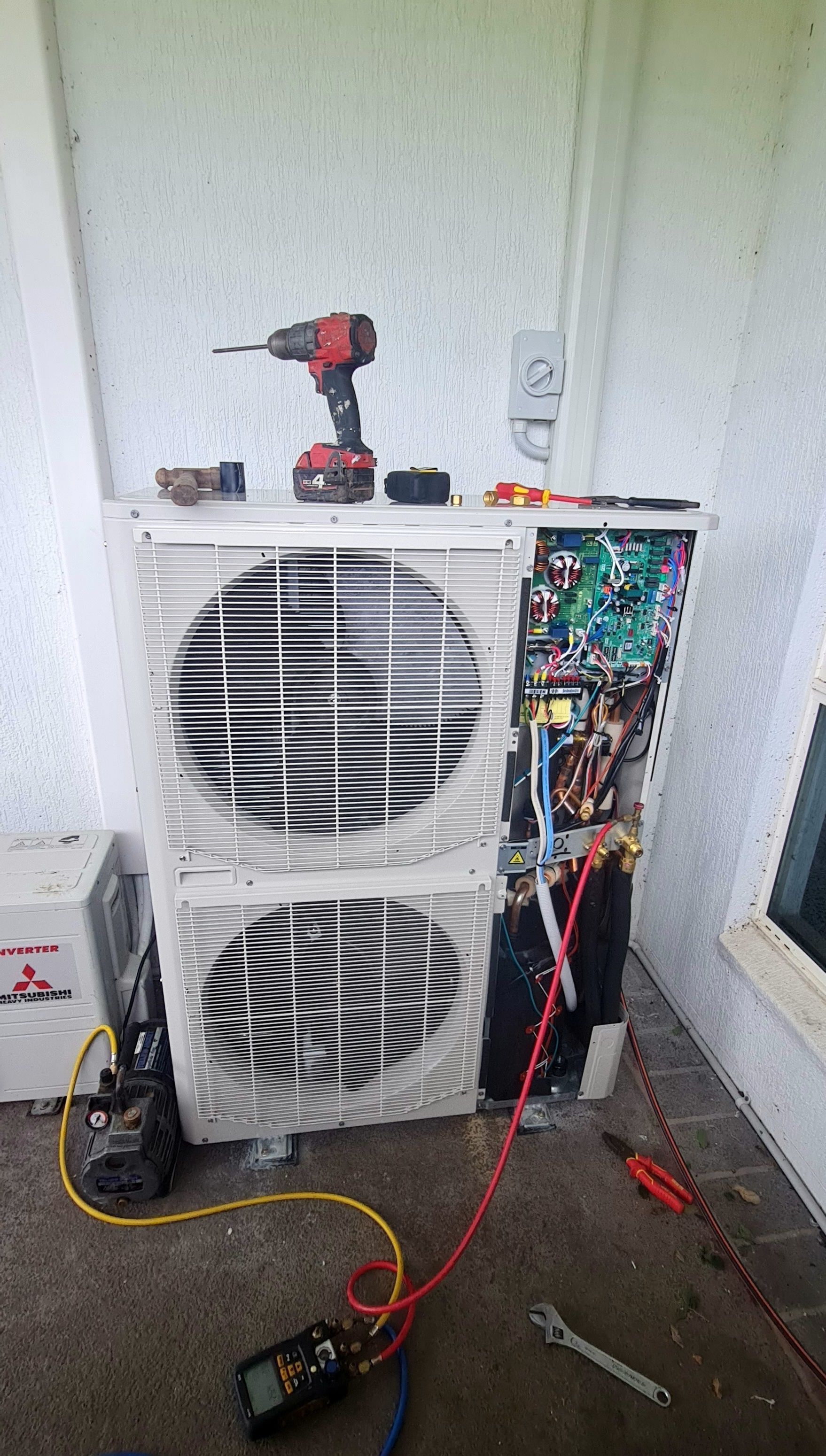 An Outdoor HVAC Condenser Unit with Its Side Panel Removed — AC/DC Electrical, Air Conditioning & Refrigeration In Zilzie, QLD