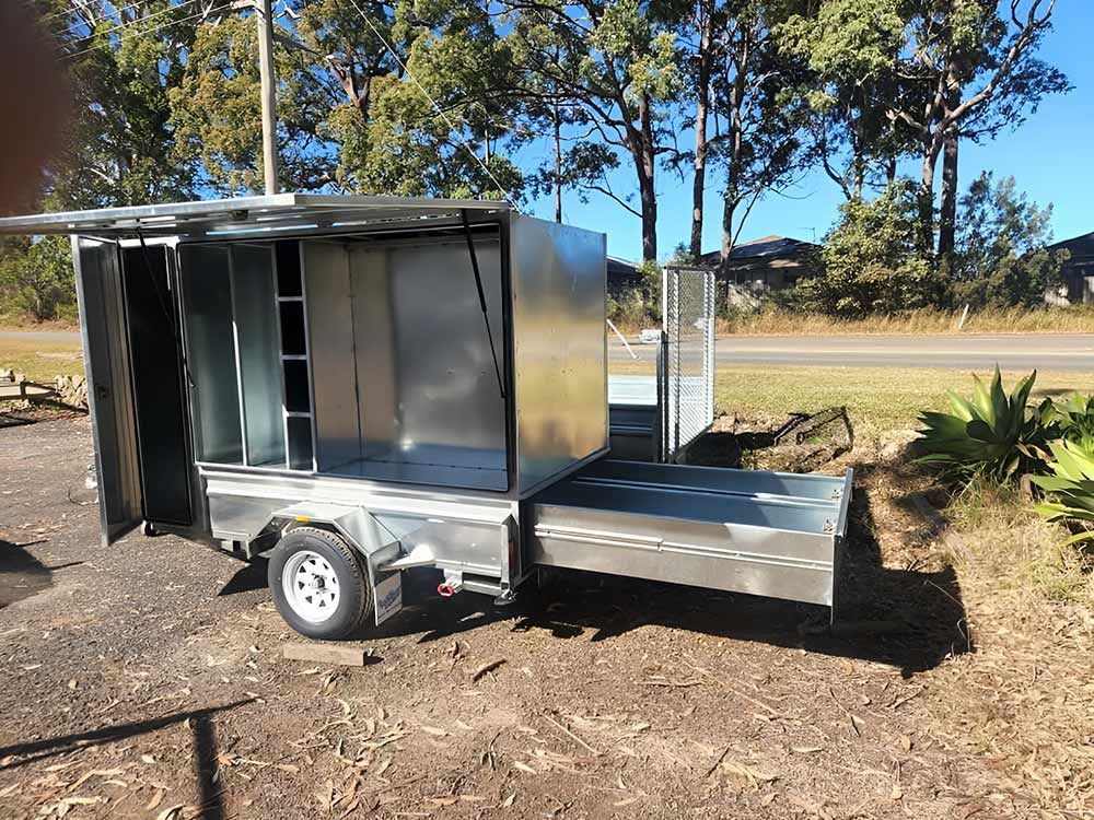 A stainless steel trailer is parked on the side of the road Hastings Trailer Centre in Port Macquarie, NSW