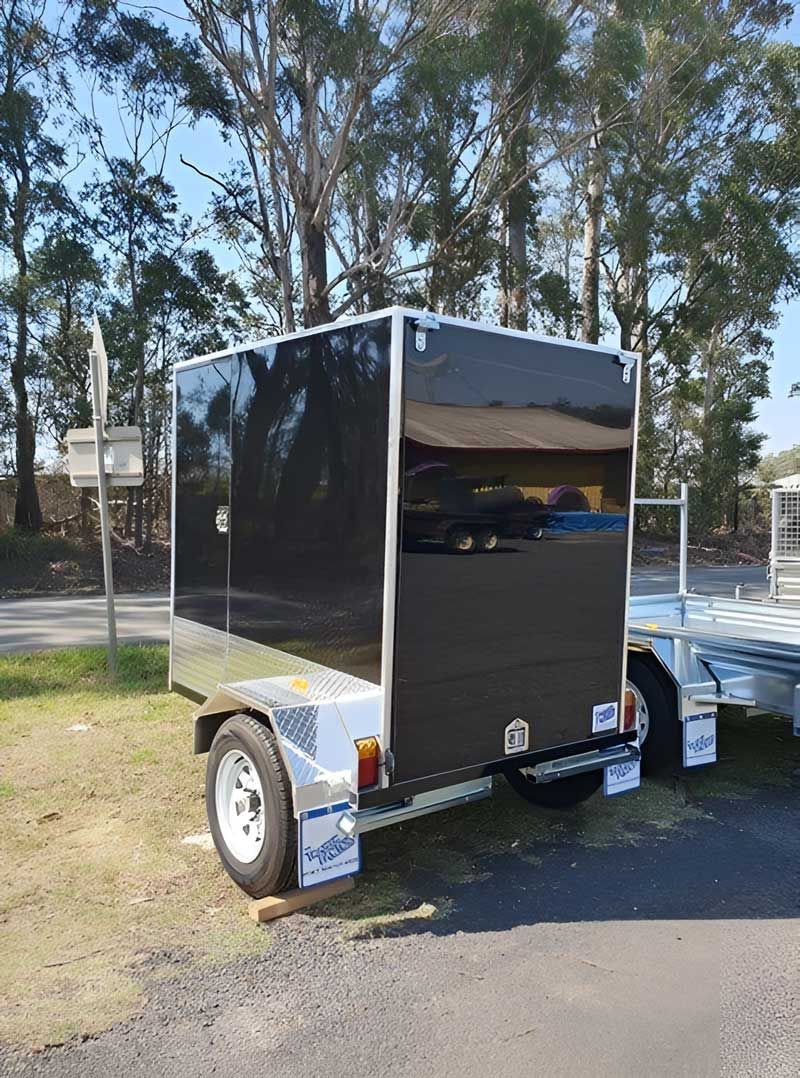 A Black Trailer Is Parked On The Side Of The Road — Hastings Trailer Centre in Port Macquarie, NSW