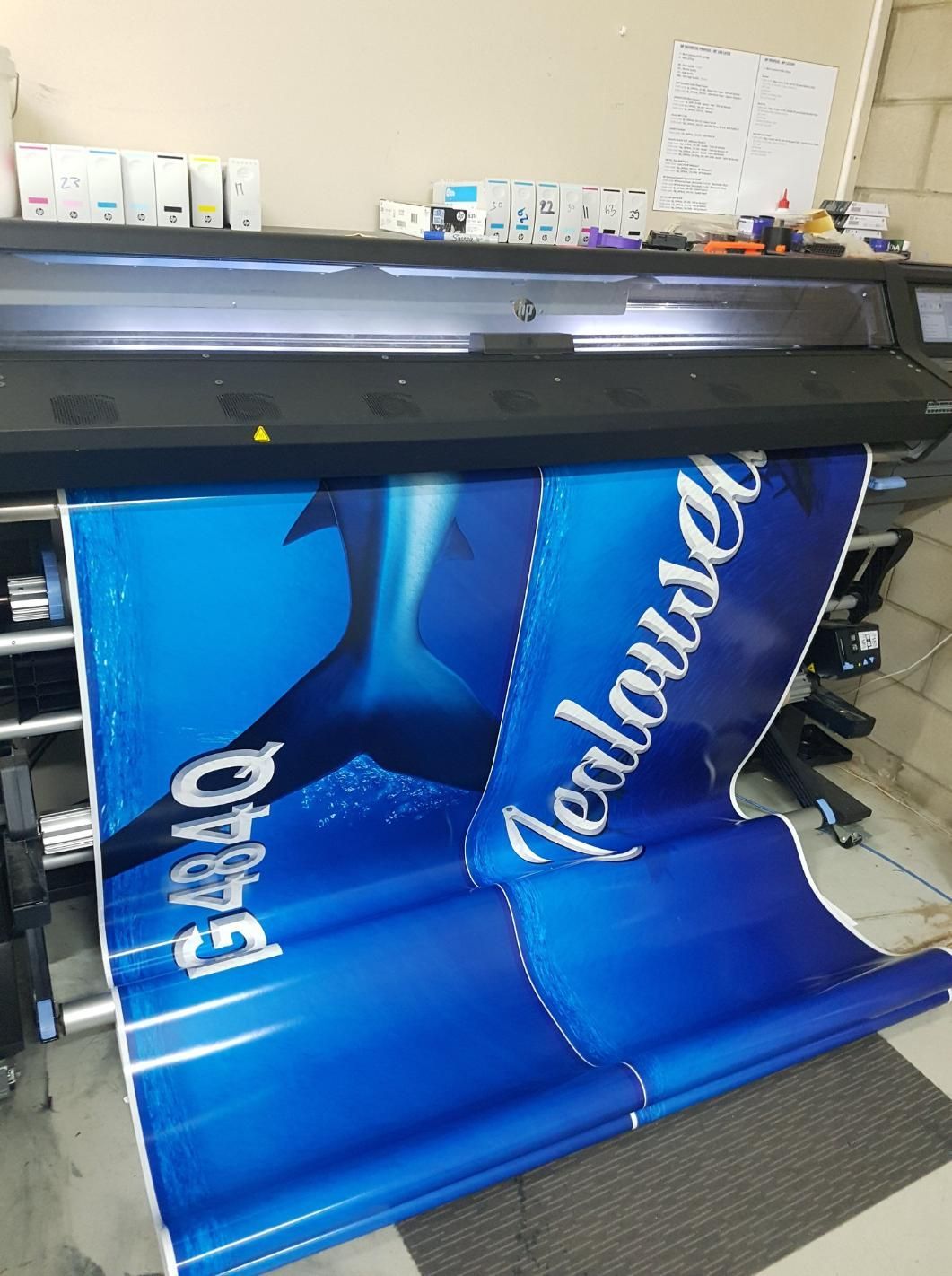 A Large Blue Banner With Jealousea Written on It — Caledonian Colour In Kunda Park, QLD